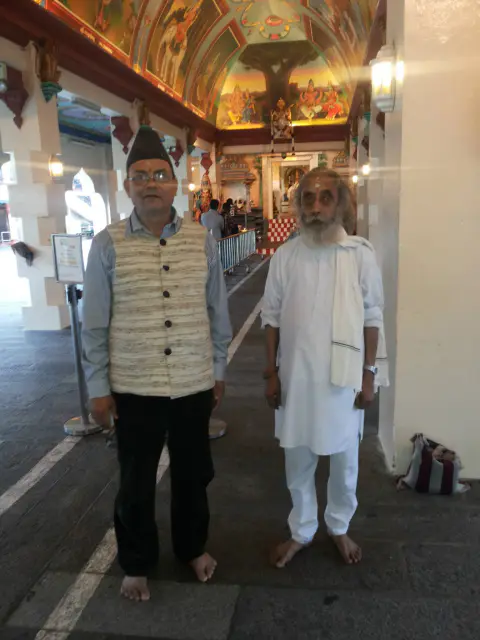 Nepali Baba and a companion standing together during a journey