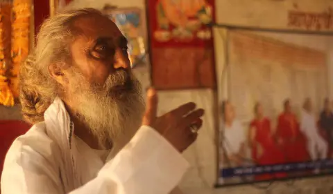 Nepali Baba speaking inside a shrine during a teaching