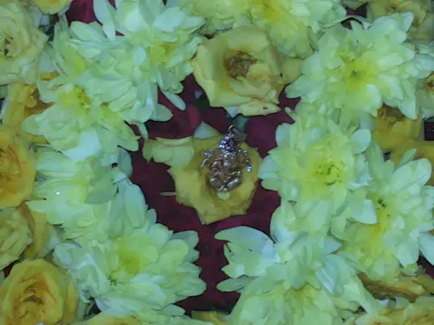 A sacred image surrounded by white flowers