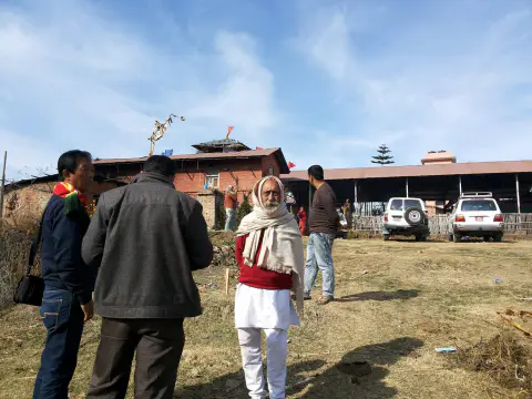Nepali Baba and community members visiting the temple site